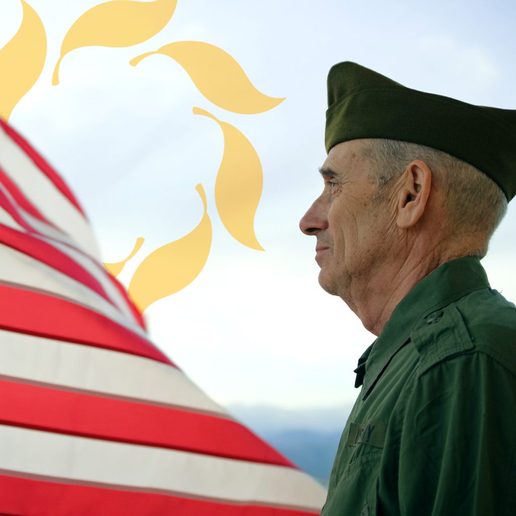 Cappella Pueblo West Senior Living Community in Pueblo West, CO - cappella of pueblo west senior male veteran looking at flag