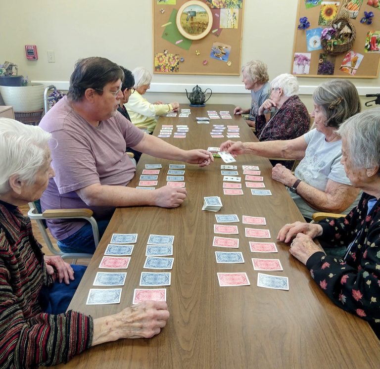 assisted living residents playing cards