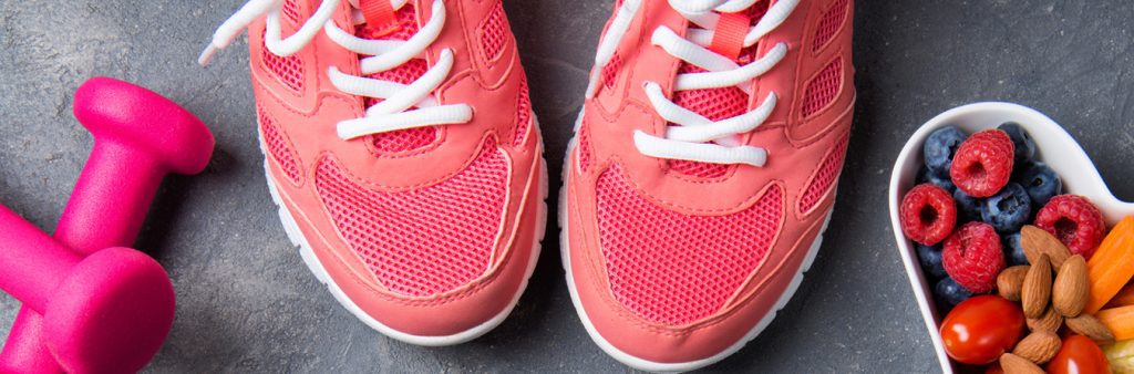 pink athletic shoes and weights