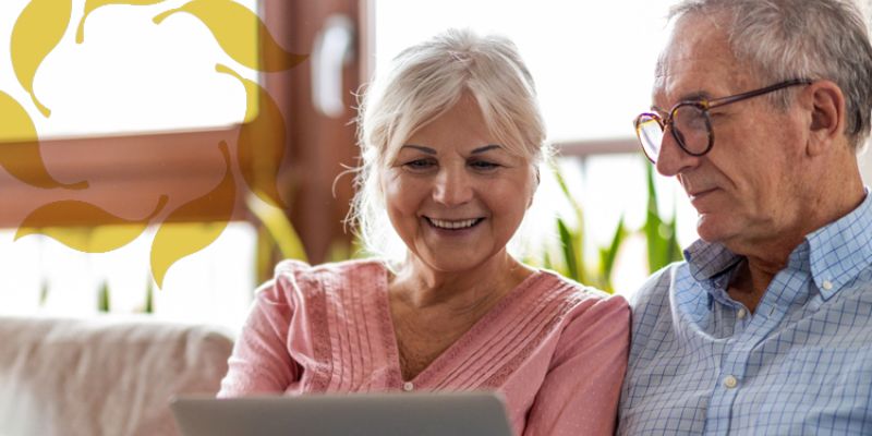 Cappella Pueblo West Senior Living Community in Pueblo West, CO - couple facetiming on computer