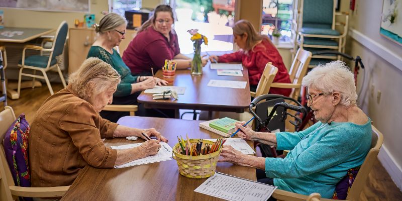 Cappella Pueblo West Senior Living Community in Pueblo West, CO - residents doing crafts