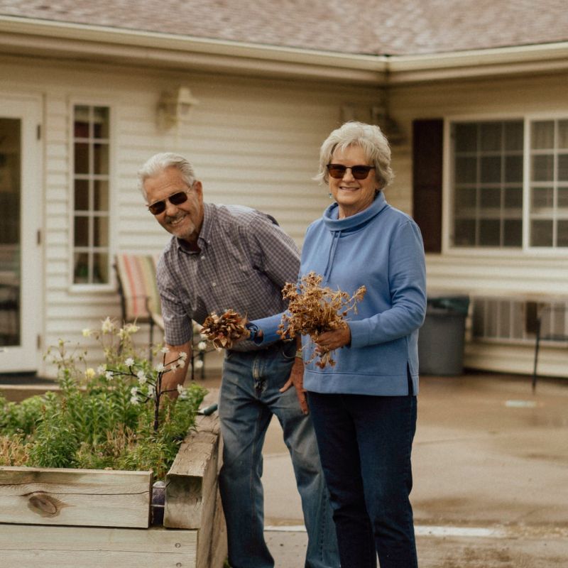 Cappella Pueblo West Senior Living Community in Pueblo West, CO - couple in the garden beds 1