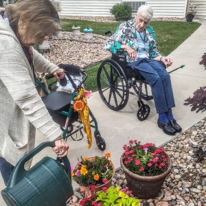 Cappella Pueblo West Senior Living Community in Pueblo West, CO - resident ladies watering the flowers 1