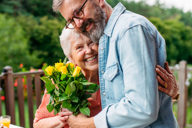 Cappella Pueblo West Senior Living Community in Pueblo West, CO - cappella of pueblo west adult son with senior mom Cappella Pueblo West Senior Living Community in Pueblo West, CO - cappella of pueblo west adult son with senior mom