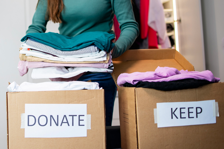 Cappella Pueblo West Senior Living Community in Pueblo West, CO - cappella of pueblo west organizing clothes into donate and keep Cappella Pueblo West Senior Living Community in Pueblo West, CO - cappella of pueblo west organizing clothes into donate and keep
