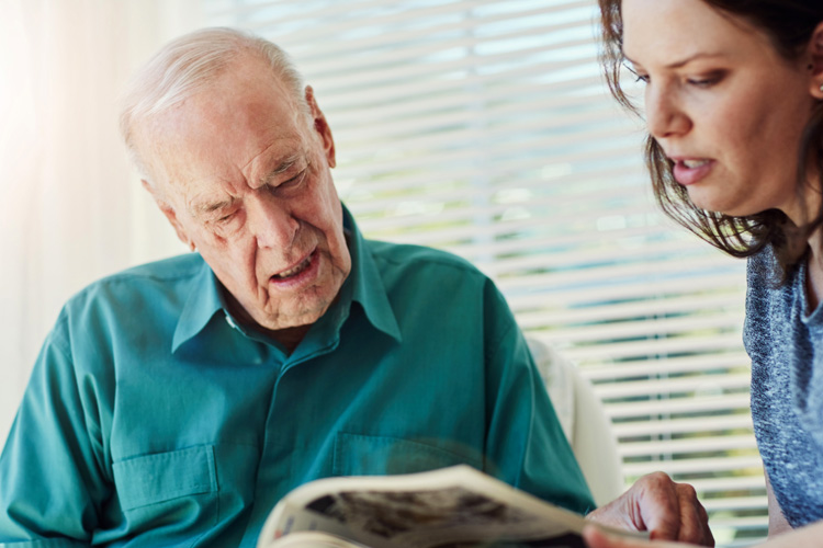 Cappella Pueblo West Senior Living Community in Pueblo West, CO - cappella of pueblo west senior man and daughter looking at a brochure Cappella Pueblo West Senior Living Community in Pueblo West, CO - cappella of pueblo west senior man and daughter looking at a brochure