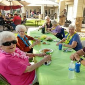 Cappella Pueblo West Senior Living Community in Pueblo West, CO - residents at a gathering square